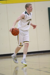 Mitch Hill, 12, brings the ball up the floor. Hill is hoping to have a very successful season, as this one will be his last as an Aviator. He looks to win his second straight GMC Championship.