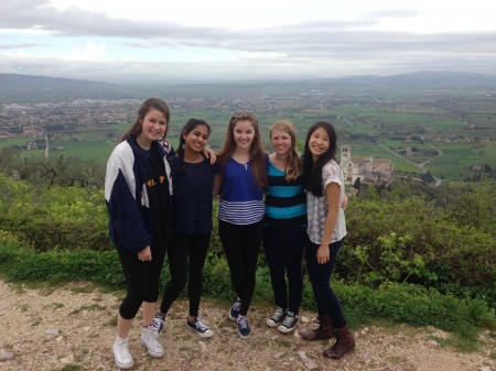 Sophomores, Madeleine Driscoll, Maya Sheth, Amara Clough, Brianna Dooley, and Caroline Gao enjoy the view from atop the fortress in the little town of Assisi. The AP European class visited this town on their drive between Florence and Rome. The main attraction of the town is the basilica of St. Francisco.  Photo Courtesy of Brianna Dooley