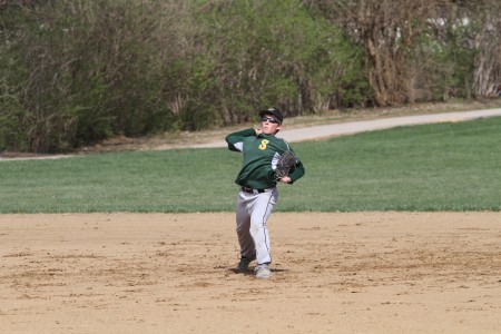 Alex Redwine, 9, fields a ground ball. The team has had a lot of players moving around, with some moving up to JV. Many players have had to adjust to new positions because of the players moving up. Photo Credit: McDaniels Photography 