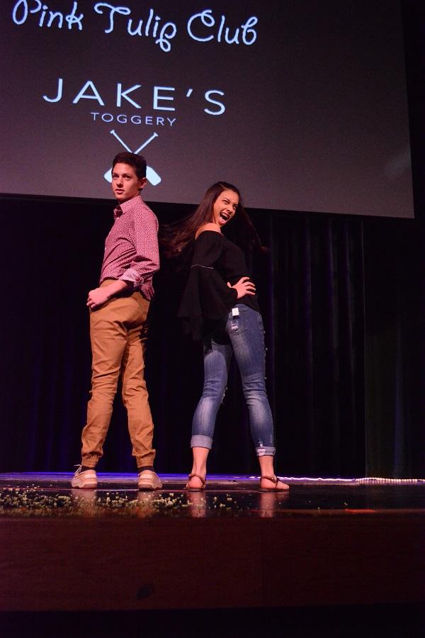 SHOW STOPPERS. Sophomores Samantha Fernandez and Jordan Pescovitz strut down the runaway during the 11th annual Fashion For The Cure. In 2014, Sycamore teamed up with the Dragonfly Foundation permanently, after the need for supporting childhood cancer patients and their families increased; their goal for the 2017 show was $30,000. “The 14 girls on the committee worked very hard to make this event possible; I am very proud of all of them as well as the student designers,” said Deborah Klempt, FFTC staff adviser.