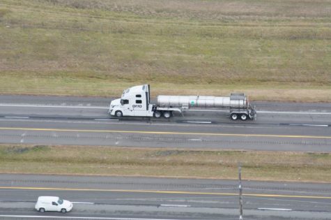 Trucks drive away from jobs