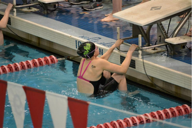 Jory Gould, 10 about to dive in for her 100 backstroke event. She swam this at the Southwest District championships. Gould practiced for the high school and is planning to do so again this. Photo courtesy of Jean Wu. 