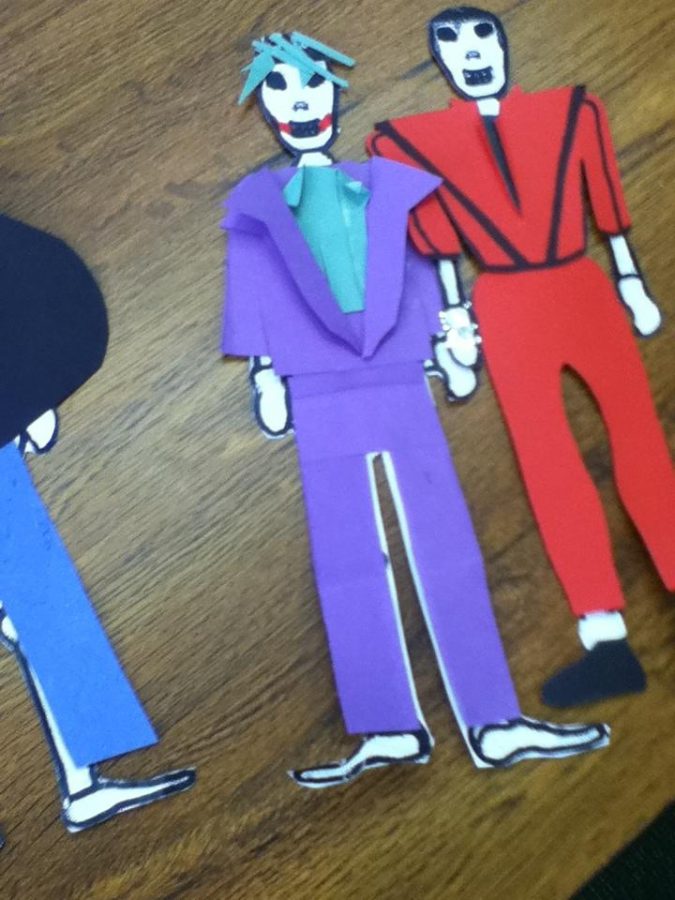 Calacas are made by students. These represent Michael Jackson, and Cesar Romero in his role as the Joker in the Batman television show that was produced in the 1960’s. The student-constructed skeletons are another way to remember and honor the dead. Photo courtesy of Emily Tyler.