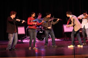 Andrew Lennor, 11, Mahima Devarajan, 2013 Michael Choi, 11, Konnor Montchai, 2013, and Aaron Pang, 12, performing Requiem(Trans-Siberian Orchestra) at last year’s Variety Show. Although there have major changes to the group’s lineup, it still has its original rock n’ roll style that appeals to listeners of many genres. The group does not get to warm up before the performance, so there is lots of pressure to be perfect before the curtain opens. Photo courtesy of McDaniel’s Photography. 