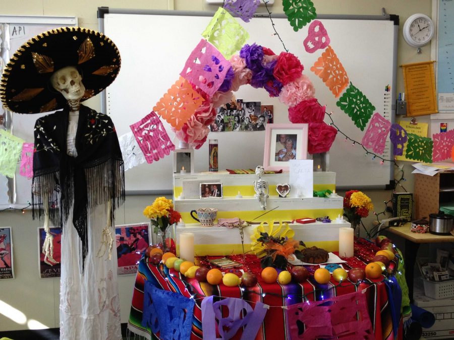 Ms. Meredith Blackmores AP Spanish class won the altar competition for Day of the Dead. Competing against the other AP Spanish, their display was selected by administrators and other teachers for its festive spirit and creativity. Dia de los Muertos, or Day of the Dead, is celebrated in Latin American countries in honor of the deceased. Photo courtesy of Meredith Blackmore.