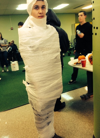 Ryan Higgins, 9 stands after being mummified in toilet paper.  He enjoyed being wrapped but it was hard standing still. Part of the party’s activities was wrapping people in toilet paper.  Photo courtesy of Lauren Kurtzer.