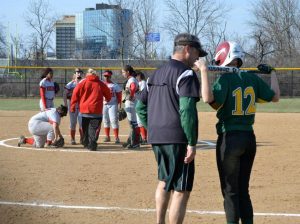 Coach Mark Weigel confers with Becca Plaatje, 12 during the Princeton game. Weigel recently announced that he would be quitting his coaching job. The athletic director is currently choosing a new head coach. Photo Courtesy of Mike Plaatje. 