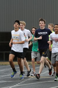 The Winter Track distance athletes run a workout outside on one of the nicer days of the winter. Indoor track runners build both their physical conditioning as well as trust throughout the season, providing a foundation for the spring athletes entering in early March. “Yes, we do have hard workouts and bad days, but winter track is fun because of the people I am with every day. They motivate me,” said Lisa Ruffin, 11. Photo courtesy of McDaniel’s Photography