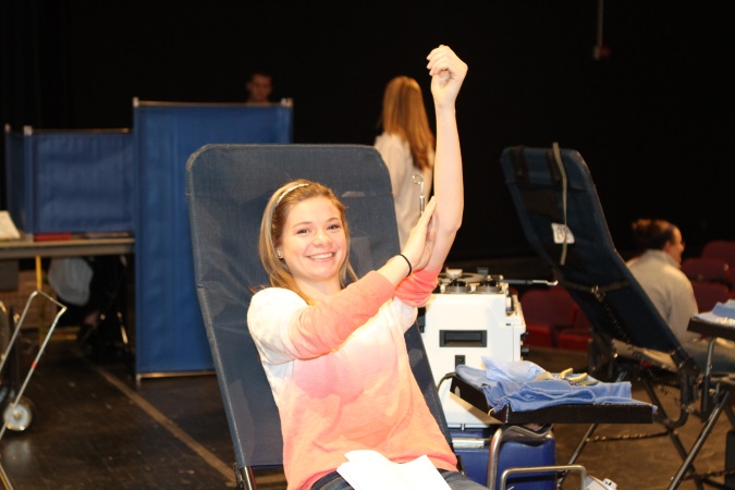 Paige Domhoff¸12 just finished donating blood to Hoxworth. The decision for SHS to host the blood drive has helped to keep the hospitals blood supply in good stock saving many lives. 
Photo courtesy of McDaniels Photography