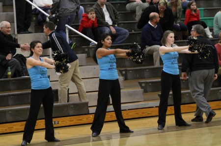 Carly Lefton 12, Rupali Jain, 12 and Katie Pruitt, 12 during pre-game at a boy’s basketball game. The team lost 12 members due to graduating seniors. The returning members will have to help the new dancers over the summer. Photo courtesy of McDaniel’s Photography. 