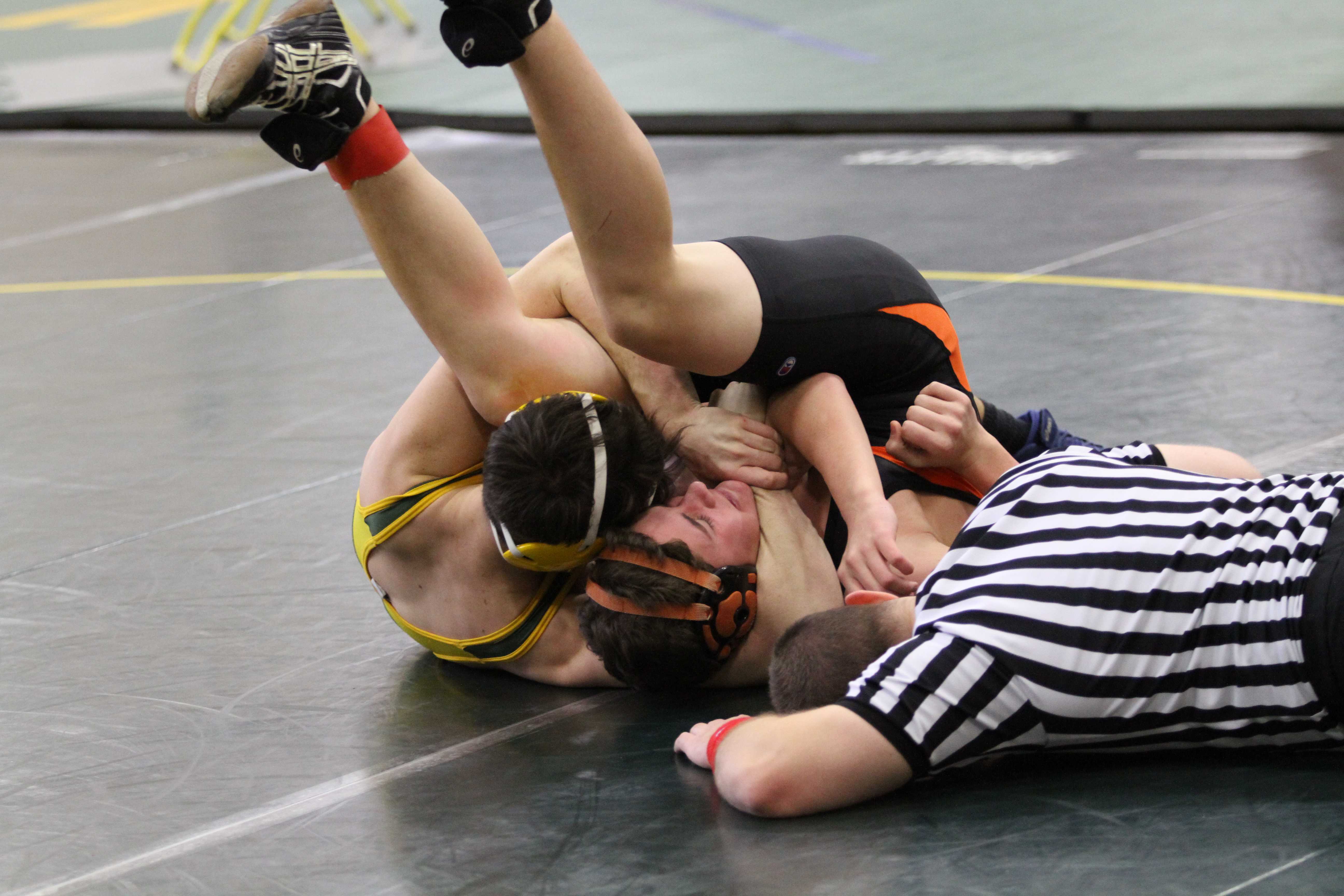 Varsity wrestling grappling opponents