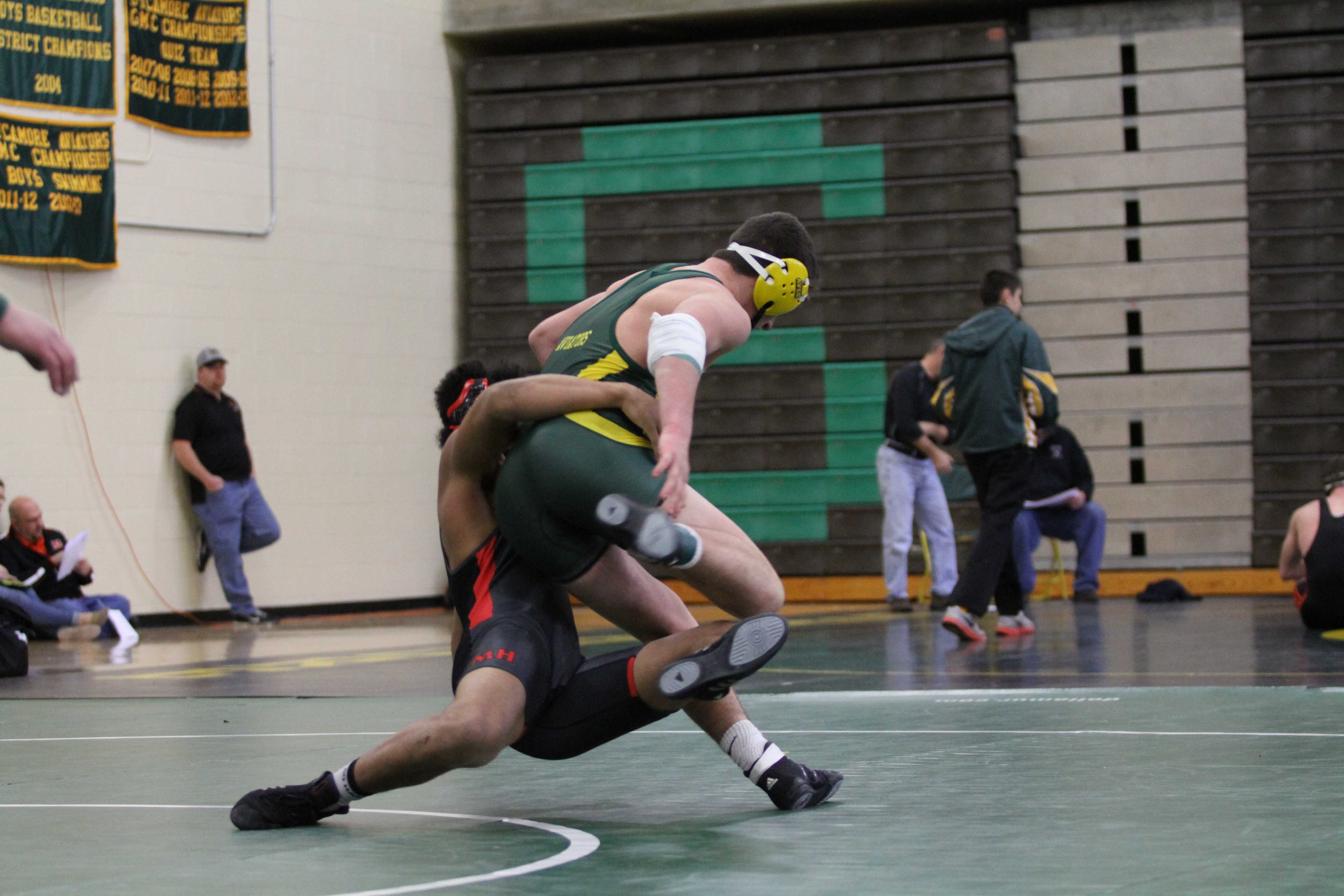 Varsity wrestling grappling opponents