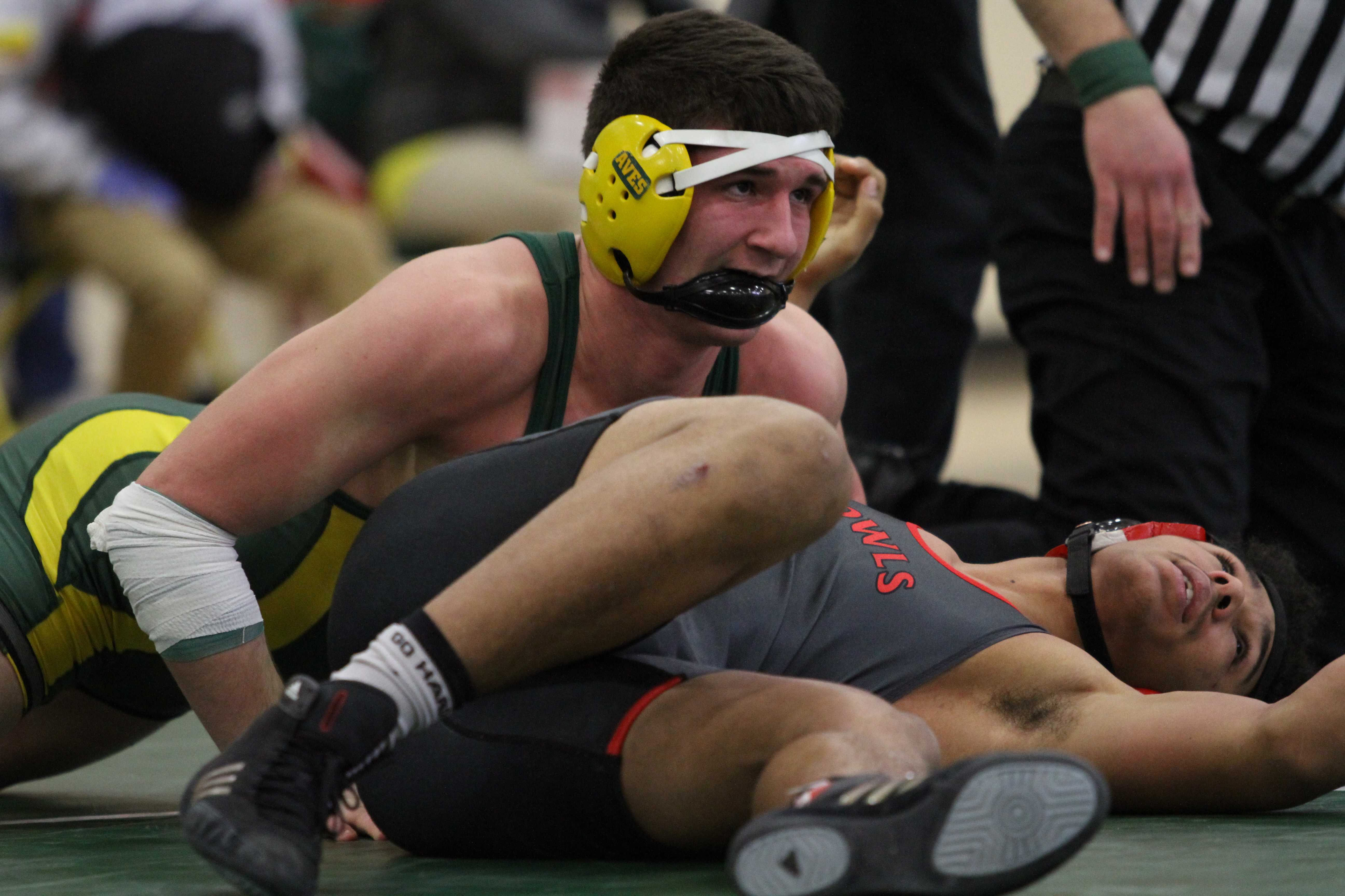 Varsity wrestling grappling opponents