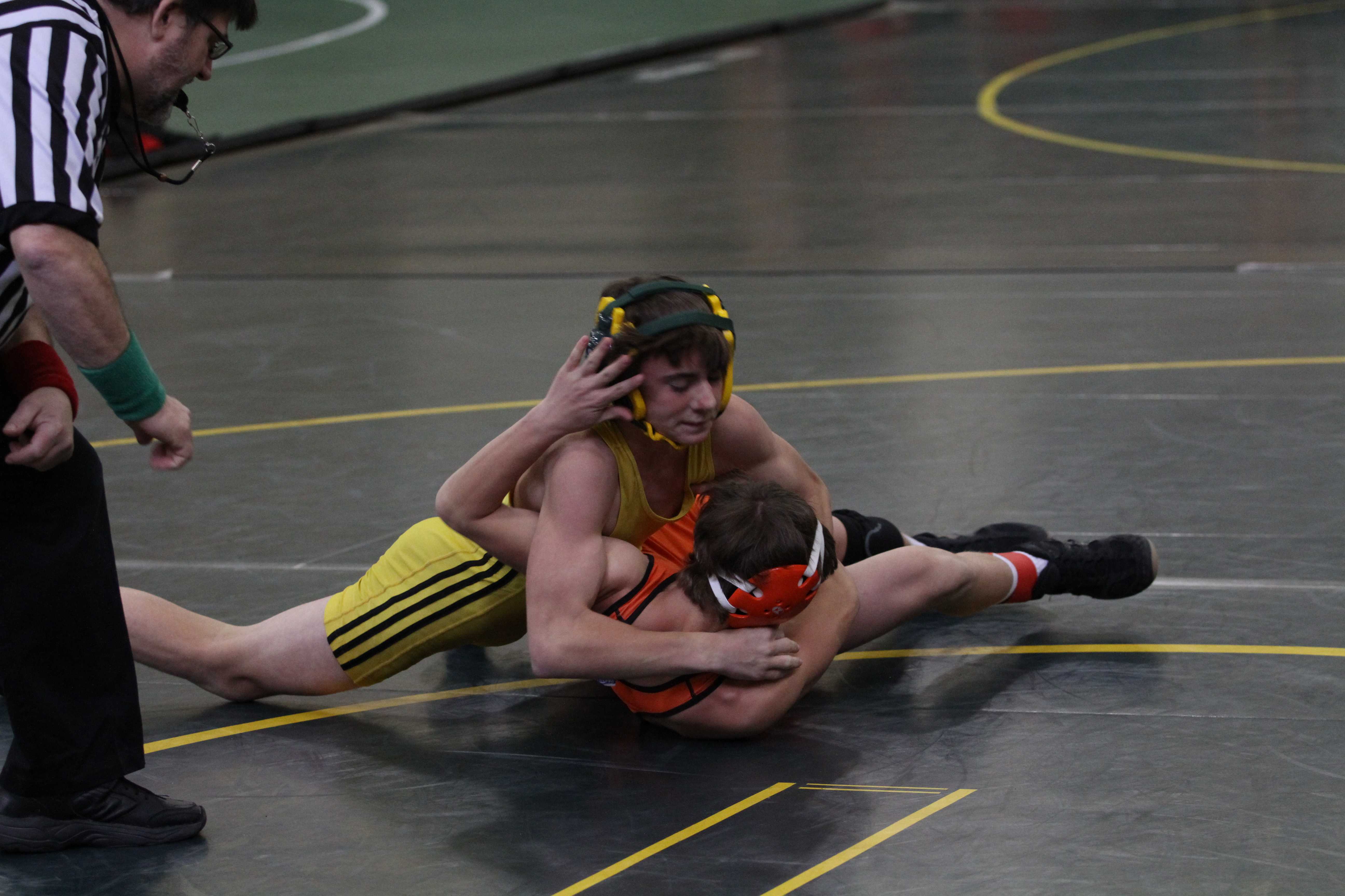 Varsity wrestling grappling opponents