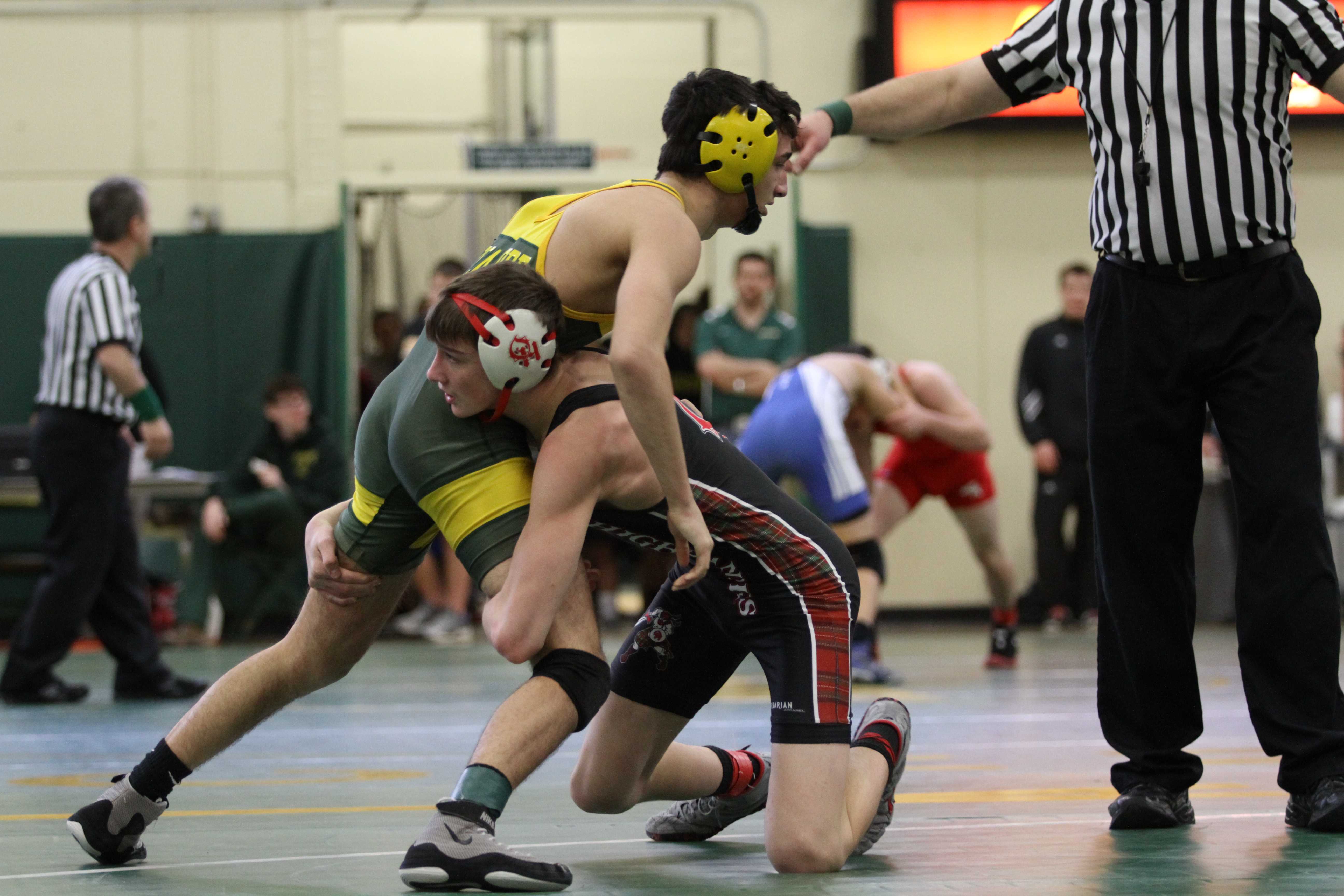 Varsity wrestling grappling opponents