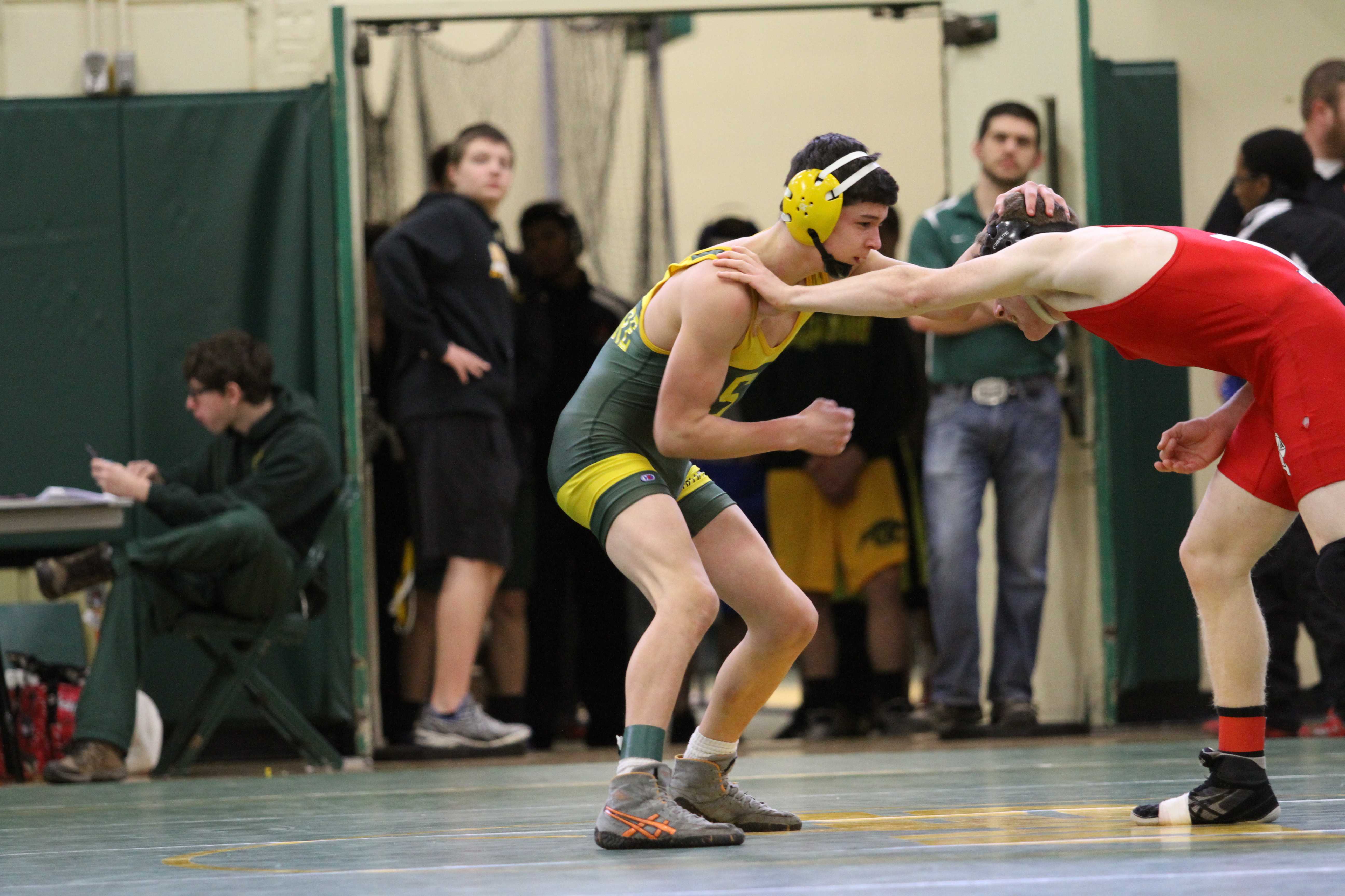 Varsity wrestling grappling opponents