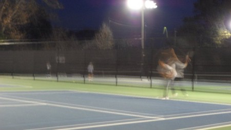 Ajay Qi, 10,  lunges for a surve. Balls such as these could be challenging to hit in windy conditions, where the ball’s movement is difficult to predict. Therefore, in unfavorable conditions, tennis players are forced to make smarter decisions in regards to strokes and ball placement. Photo courtesy of Joseph Ahn. 