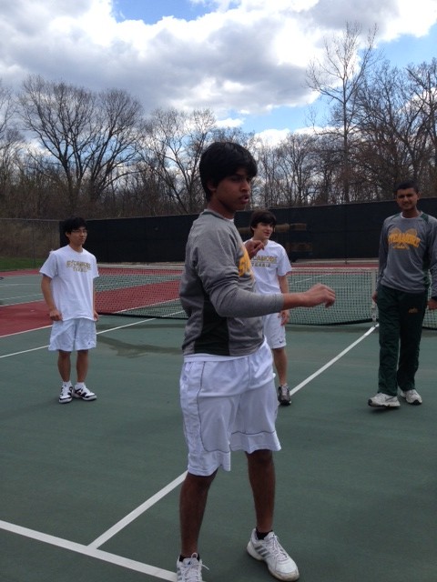 The team stretches before the match so they can be as fit as possible. Team Captain Rohan D Souza, 10, leads the stretches. The team is getting ready to take on Turpin High School.