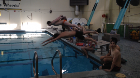 Niu and Ethan May, 11 dive off the blocks at the start of a 200 yard freestyle. At the end of practice, they decided to race each other. Friendly competition like this occurs all of the time and is one of the aspects of the Marlins that both boys enjoy. Photo courtesy of Isaac Goldstein