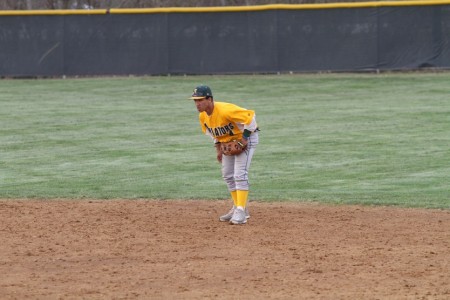 Ben Gunn, 12, fields a ground ball. Gunn will continue playing baseball in college, signing with NAIA school Miami Hamilton this past week.  Photo Credit: McDaniels Photography 