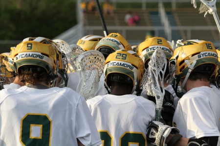 The Varsity lacrosse team huddles before a game. Spirit is a big part of the team, especially after the injuries of both Mark Reinhart, 12, and Sean Cliver, 12. The team will enter the post season tournament with a May 22 game against Springboro. Photo courtesy of McDaniel’s Photography