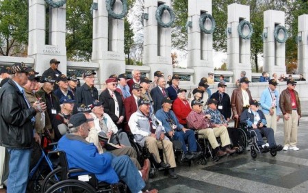Members of the 2012 Honor Flight gather around the World War II American Pacific War Memorial in Washington, D.C. The goal of the Honor Flight program is “To Fly as many World War ll and Korean veterans to see their memorials in Washington DC as we can – as fast as we can.” The trip is of no cost to the veterans, and special events besides memorial visitations are scheduled throughout the day, including a surprise mail call. Photo courtesy of Mr. Larry Blackmore