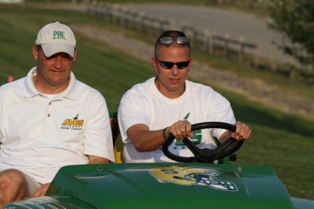 Coach Steve Nester, left, leads a pack of runners at the Sycamore Sunset Invitational. He is no longer the head cross country coach of the girls team. Coach Richard Shomo from the Junior High has stepped up to the position. Photo Courtesy of McDaniel’s Photography. 