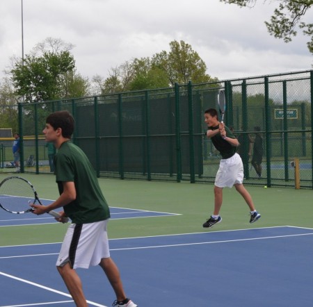 Ajay Qi, 10, drives a backhand. Qi played for multiple positions, even playing matches for the Varsity A team. Nick Hershey, 12, readies himself for a volley at the net. Photo courtesy of aves10s.net. 