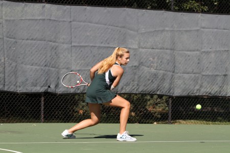 Having the new tennis facility completed causes players to be even more eager to begin playing. Clinics are offered during the summer to improve hitting technique. Members must also run the mile. Photo courtesy of McDaniel’s Photography. 