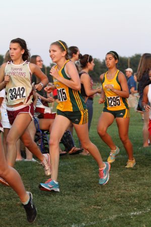 Alexis Rile, 10, runs in the annual Sunset Invitational at SHS. She plans to return this fall to run on the team. For the past three seasons of SHS cross country, Steve Nester coached the girls’ team. As he steps down, Mr. Rick Shomo and Mr. Greg Pottebaum will assume the position.  Photo courtesy of McDaniel’s Photography