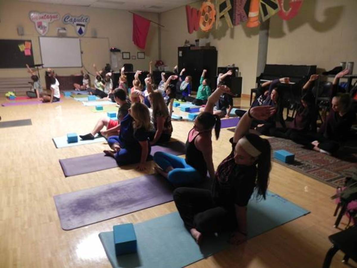 Yoga club begins its session with each individual focusing on their breathing. The club meets every Wednesday in the mirror room. The club is led by Meredith Blackmoore.