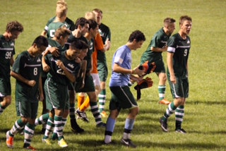 Celebrating after the game-winning goal, the Boys Varsity Soccer team surrounds teammate and senior Yuan Zhang. The team is now 5-1 and takes on Mason at home on Thurs. Sept. 11 at 7 p.m.  