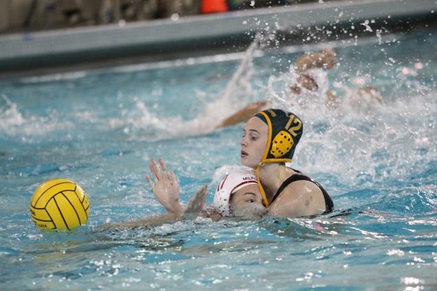 Junior+Hannah+Kast+plays+defense+against+an+opponent+from+Milford+High+School.+Kast+was+a+part+of+the+2012+and+2013+water+polo+teams+at+SHS+who+both+got+second+in+the+state.+She+always+plays+for+the+club+team+Moose+Water+Polo.+