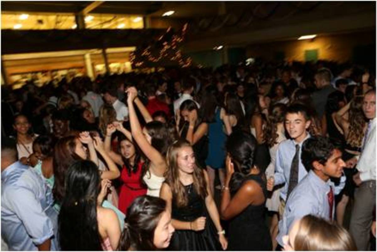 A group of students party hard to the music being played at the Homecoming dance. In past years, grinding has been heavily discouraged, but no such measures were put in place or mentioned before this year's dance. However, teachers and parent volunteers were still on hand to block exits, hand out water, check bags and moderate events. 
