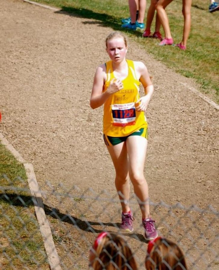 Sophomore+Sarah+Hofmann+rounds+the+corner+to+finish+the+St.+Xavier+Cross+Country+Invitational.+Hofmann+has+been+running+with+the+team+since+she+arrived+two+weeks+before+the+start+of+school.+%0A%E2%80%9CIt+definitely+makes+it+easier+to+have+people+around+you+to+help+you+in+school+and+get+into+this+completely+different+culture.+They+have+helped+me+feel+at+home%2C%E2%80%9D+Hofmann+said.