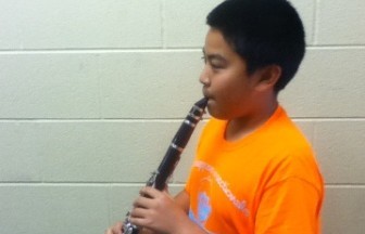 Xiang plays the clarinet. Xiang had never marched until this year. He has played the clarinet for eight years.