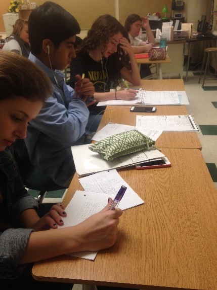 Sophomores Gail Duke, Chiraag Bhola and Karina Rosa as they work hard during fast track. Many students listen to music to focus. Fast track is a way to have a study hall but also make a difference during that time. 