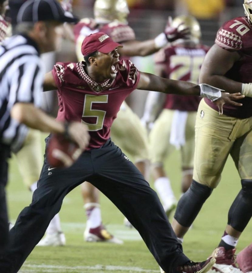 Jameis+Winston+during+the+Clemson+game+coming+on+to+the+field+to+celebrate.+He+was+suspended+from+this+game+for+yelling+obscene+comments.+He+tried+to+come+out+in+his+pads+but+was+sent+back.+