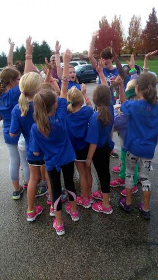The+girls+from+the+Symmes+branch+doing+a+cheer+after+they+completed+the+practice+5k.++For+many+this+was+their+first+serious+running+experience.++%E2%80%9CIt+was+fun+learning+their+names+and+cheering%2C%E2%80%9D+Martinson+said.++Photo+courtesy+of%3A+Meredith+Gottliebson
