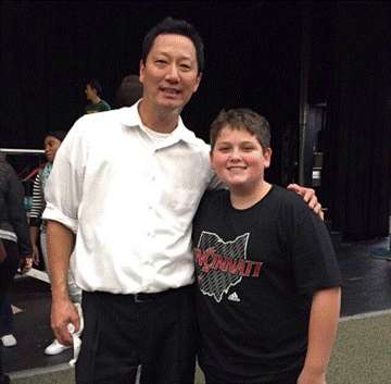 Sophomore Matthew Miller takes a picture with UC President Santa Ono. Ono came to visit on the final day of Homecoming spirit week. He played Ping Pong with students in a spirit competition. (PHOTO CREDIT TO ONO)