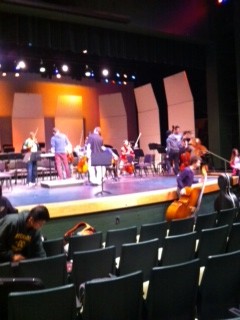 Orchestra practices in the little theater for the Senior Spotlight concert. Orchestra and certain concert band members practiced in the theater a few days before the concert to get used to the sound on stage. However, seniors soloing have been preparing their pieces for months, and cannot wait to show their hard work to parents and peers. 