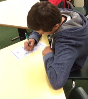 Freshman Zachary Sheehan takes a Scantron test. Most classes took their pre-tests on Scantrons, like the class in which Sheehan took his test. Though teachers easily graded these Scantrons, they, along with students, still feel that pre- and post-tests are a waste of time. 