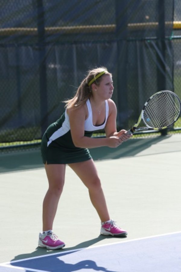 In a singles match the player can only depend on themself. Concentration is key as well as maintaining the proper stance preparing to return. Junior, Amanda Peck awaits the serve in ready position.