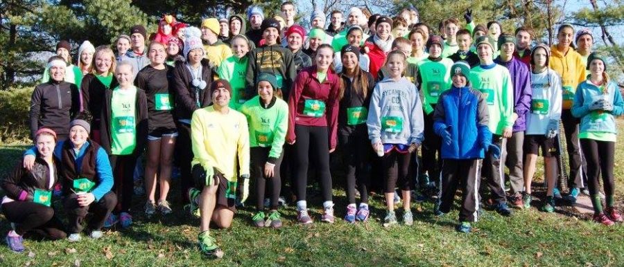Coach Richard Shomo and all former, current, and future junior high cross country runners pose at the annual Younglife Gobble Gobble 5k. The 5k attracts families from across the community. It is not too late to sign up. Photo Courtesy of Richard Shomo. 
