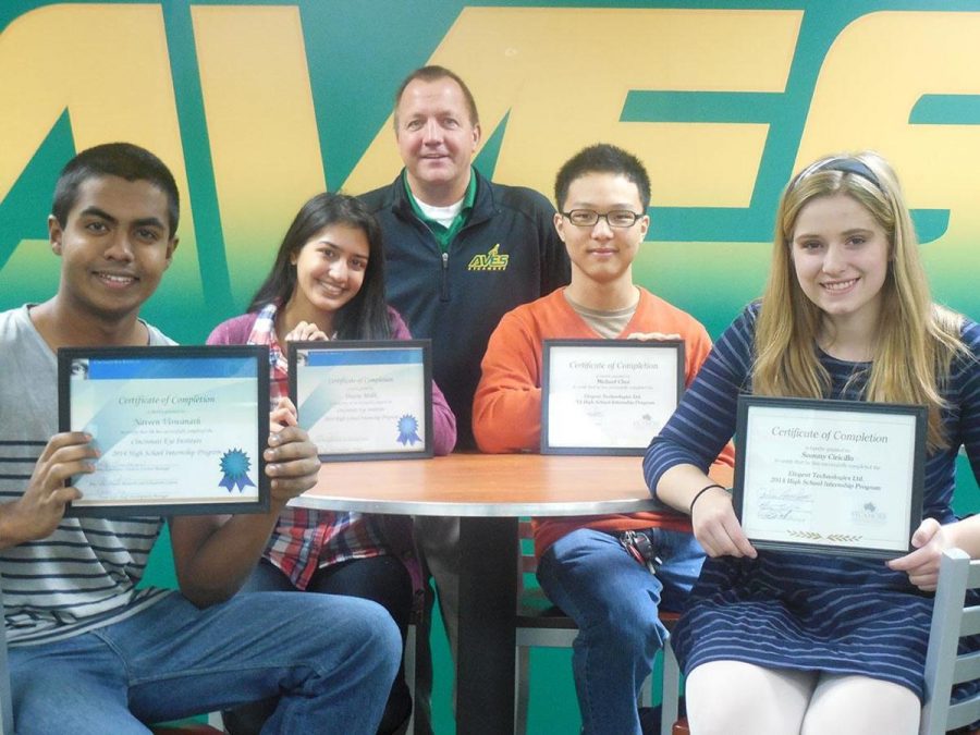 Students receive certificates to congratulate the completion of their programs. (left to right) Naveen Viswanath and Shazia Malik both went through an internship at the Cincinnati Eye Institute while Michael Choi and Samantha Ciricillo went through an internship at Etegent. All students stand with Principal Doug Mader. 