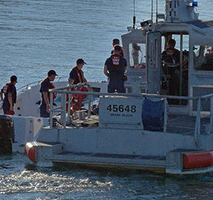 Coast Guard officers head out to rescue a capsized boat off of Miami, Florida on 0ctober 16, 2013.  Four people drowned, 11 were rescued. Aside from sea emergencies, the Coast Guard is also responsible for port safety checks, stopping drugs smuggled in by boats from reaching ports, inspecting cruise vessels, and assisting and saving people. Photo courtesy of MCT Photo. 