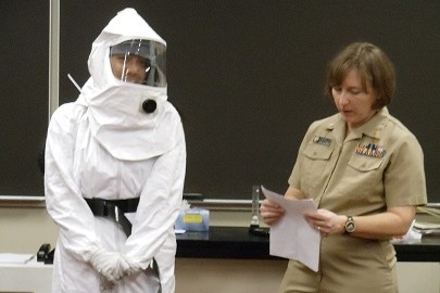 Freshman Leah Wallihan is dressed in a hazmat suit worn by nurses and other health officials who work with Ebola patients.  Estill walked through the precautions that are taken with gearing up.  She also discussed the steps with donning and doffing the suit.