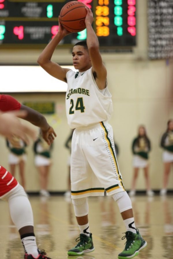 Freshman guard Christian Kelly looks for an open teammate to pass to. Kelly is one of two varsity starters in their freshman season. His season high in points was 13 in a loss to Fairmont later in the season.