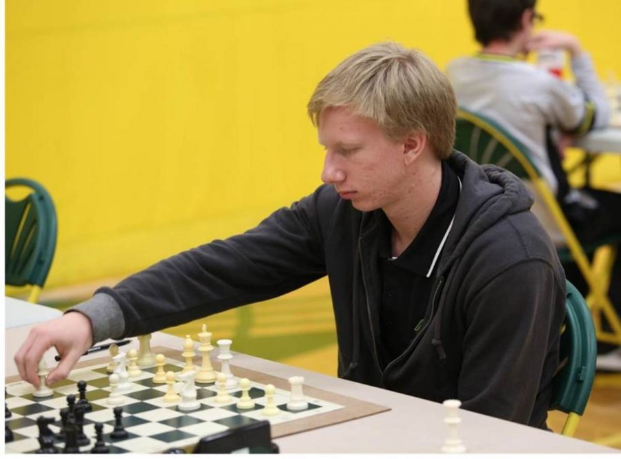 Junior Kevin Kohmescher moves his pawn. Chess is proven to improve IQ, creativity, and memory. A study of 4000 Venezuelan students showed significant increases in IQ after four months of chess study. 
