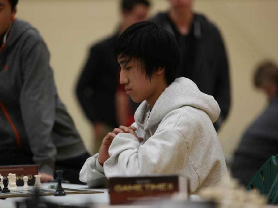 Junior David Wang contemplates a move. “I think [the season] was pretty good but there were some matches we could have done better,” Wang said. The team finished the season with a win-loss record of 18-2.
